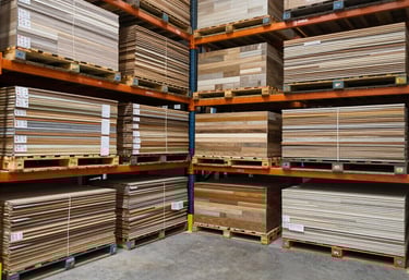 Close-up of sturdy yard tools neatly arranged on steel shelves under warm lighting.