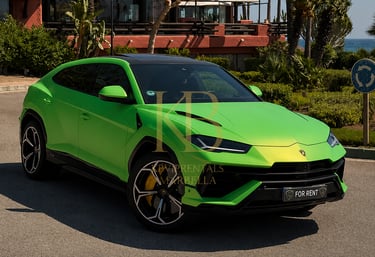 A lime green Lamborghini Urus luxury SUV parked at an upscale tropical resort in Marbella.