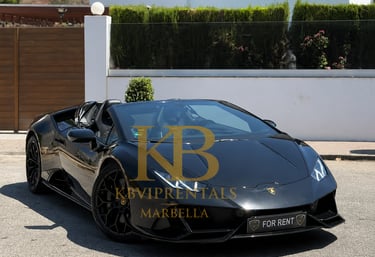 Sleek black Lamborghini Huracan Evo Spyder luxury car rental parked in Marbella.