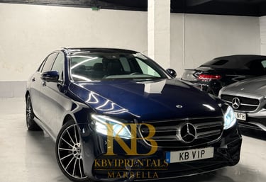 Luxury dark blue Mercedes-Benz E-Class sedan parked in a Marbella VIP rental garage.
