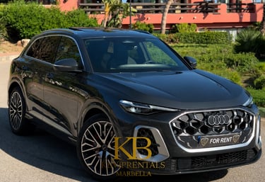Luxury black Audi Q8 SUV for rent in Marbella, featuring sporty rims and elegant design.