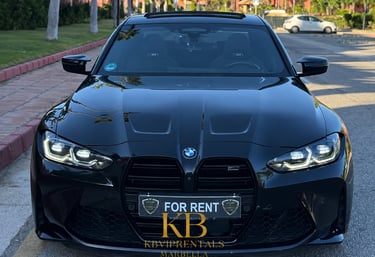 Front view of a sleek black BMW M4 Competition for rent in Marbella, showcasing its luxurious design and powerful presence