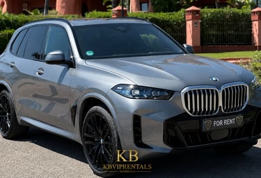 Luxury silver BMW X5 SUV for rent in Marbella with black alloy wheels and a sleek modern design.