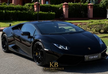 Sleek black Lamborghini Huracan luxury car for rent parked in Marbella.