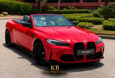 Red BMW M4 convertible for rent in Marbella with black wheels and luxury white leather interior.