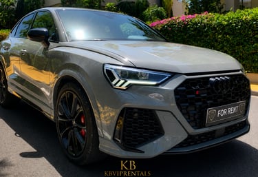 Luxury grey Audi RS Q3 Sportback for rent in Marbella with black wheels and red brake calipers.