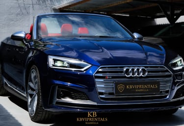 Luxury blue Audi S5 convertible rental with red leather interior parked at KB VIP Rentals Marbella.