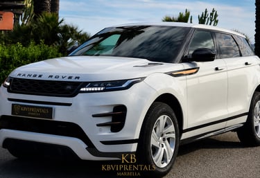 White Range Rover Evoque luxury SUV rental parked in Marbella with palm trees and a blue sky background.