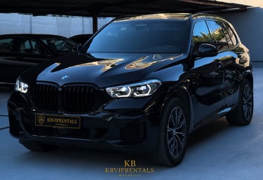 Luxury black BMW X5 SUV parked at KB VIP Rentals Marbella for premium car hire services.