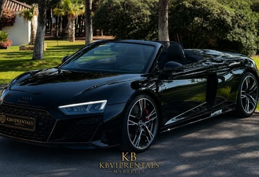 Black Audi R8 Spyder luxury convertible car for rent in Marbella, Spain.