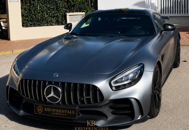 Matte grey Mercedes-AMG GT luxury sports car parked outdoors in Marbella.