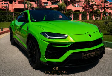 Lime green Lamborghini Urus luxury SUV rental parked in front of a Mediterranean resort in Marbella.