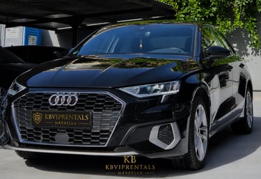 Sleek black Audi rental car parked in Marbella with luxury KBVIPRENTALS branding.