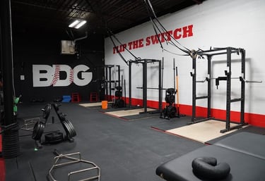 a gym room with a bench and a bench with a bench top