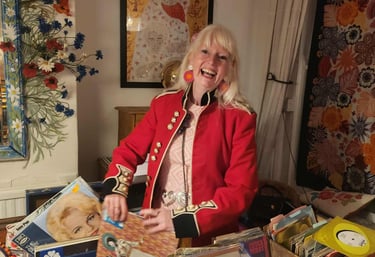 DJ Charlotte Hypno Bird playing records at a 60th birthday party wearing 60s vintage dress