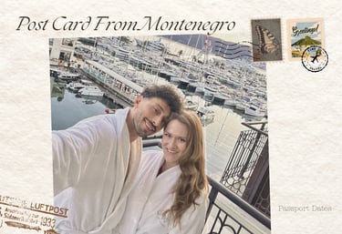 Couple in white robes taking a selfie at a luxury Montenegro marina resort with yachts in the background.
