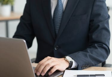 Modern office workspace with professionals collaborating over documents and laptops.
