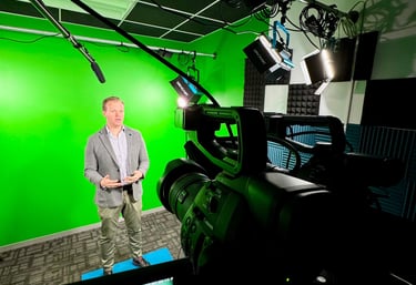 Nick Reese in front of a green screen recording a speaking enagement
