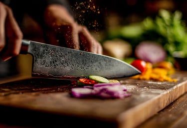 a person is cutting up vegetables on a cutting board