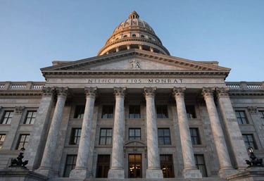 An architectural low-angle shot of a majestic North American government building with pillars, blue hour lighting, professional and authoritative tone.