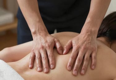 A serene spa room with soft lighting and a massage table ready for a relaxing body massage.