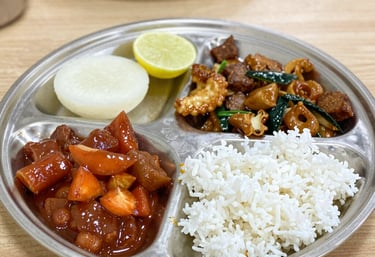 A washing machine and drying area in a tidy, well-lit space.