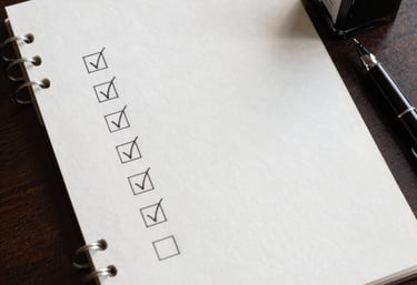 A warm handshake between a German employer and an Indian candidate in a bright office.