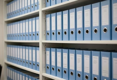 An organized legal archive with light blue folders on white shelves, representing meticulous attention to detail in tax and corporate legal matters, South American law firm interior.