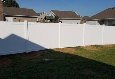 White vinyl residential privacy fence installed at a home in Central Kentucky