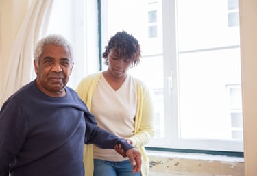physiotherapy at home for seniors - an elderly man looking happy to be helped by The London Physio