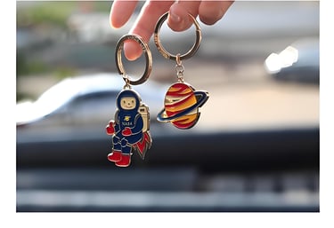 two enamel key chains