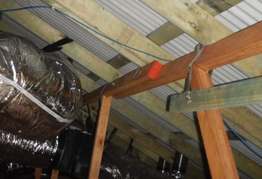 Perth building inspector documenting defects for warranty claim report.