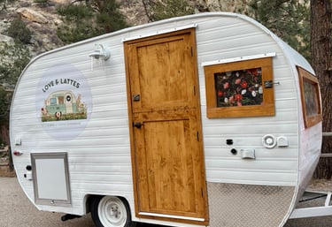 Love & Lattes vintage mobile coffee trailer at an outdoor event in Northern Colorado