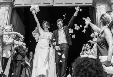 a bride and groom walking down the aisle of a wedding ceremony