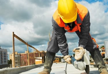 a construction worker is working on a roof top