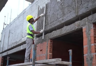 a construction worker is working on a building