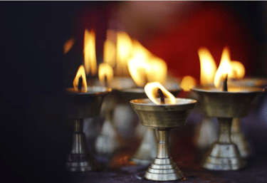 a group of candles with candles in a row