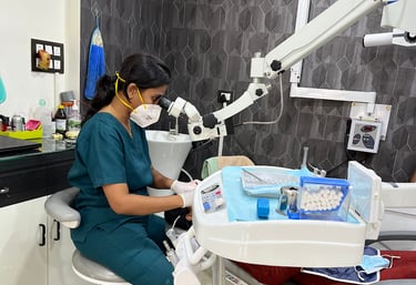 Dr. Pallavi Surwade Jamodkar doing complex RCT under microscope for best results.