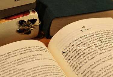 Open book on a table with letters clearly visible and in Spanish Language