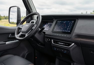 The interior cabin of a modern DAF xf 480, showcasing cutting-edge technology and minimalist controls, soft natural light, Central European / Polish setting.