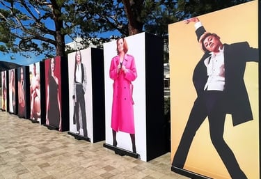 a row of posters with a man in a tuxedo | CORPORATE EVENT | The Kabir Company