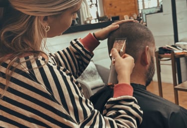 stylist cutting mens hair at Meraki and Co salon and spa greer sc 