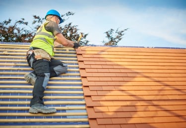 man installing a new orange roof