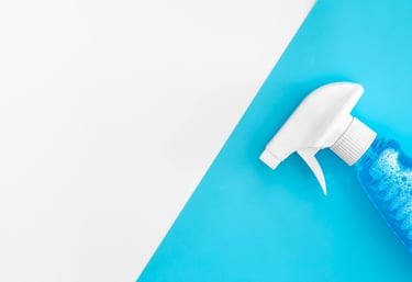 a spray bottle with a spray bottle on a blue and white background