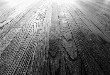 Close up of refinished hardwood floor grain showing restoration quality and dustless sanding results