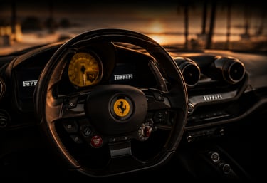 Luxury Ferrari car interior featuring a carbon fiber steering wheel at sunset.