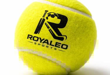 Yellow felt tennis ball with black Royaleo Sports logo featuring a cricket bat and ball.