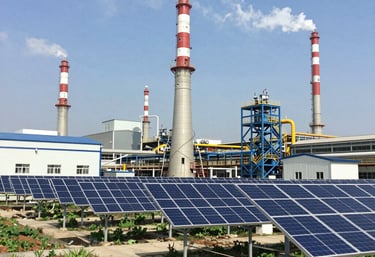 Close-up of energy grid technology with glowing blue and green lights.