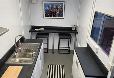 Interior of a fully equipped temporary kitchen pod provided during insurance claims and home renovation projects.