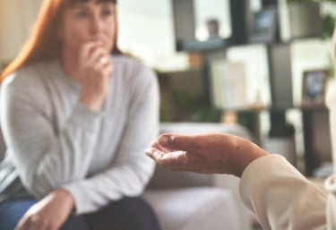 Woman listening carefully during a life coaching session.